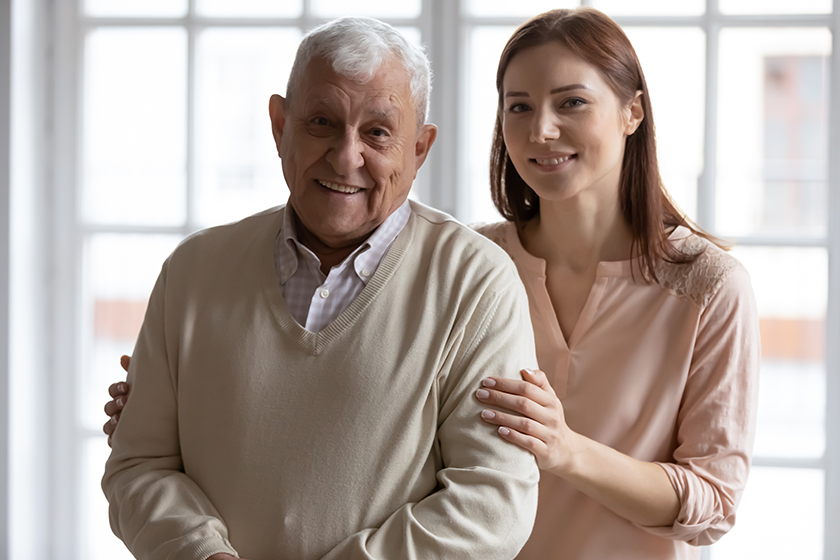 head-shot-portrait-smiling-older-man-with-grownup-daughter